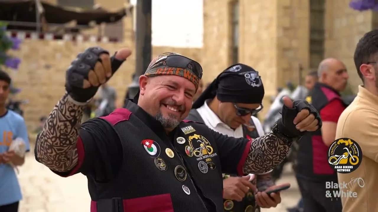 A rider in a patched leather vest at the Arab Bikers Rally, Jordan
