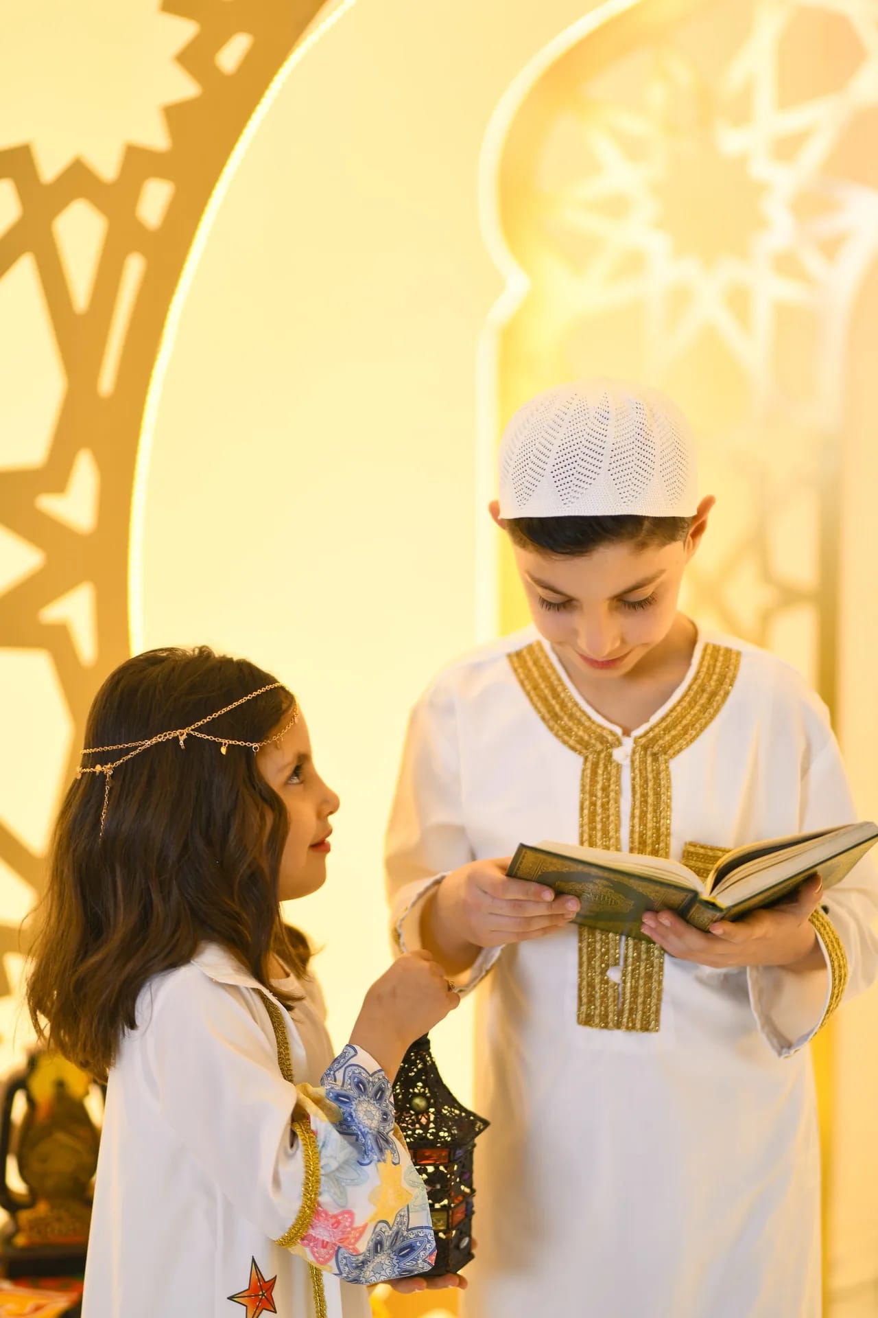 A brother reading to his sister in the Ramadan set