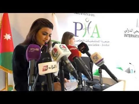 A speaker at a press podium, International Healthcare Travel Forum
