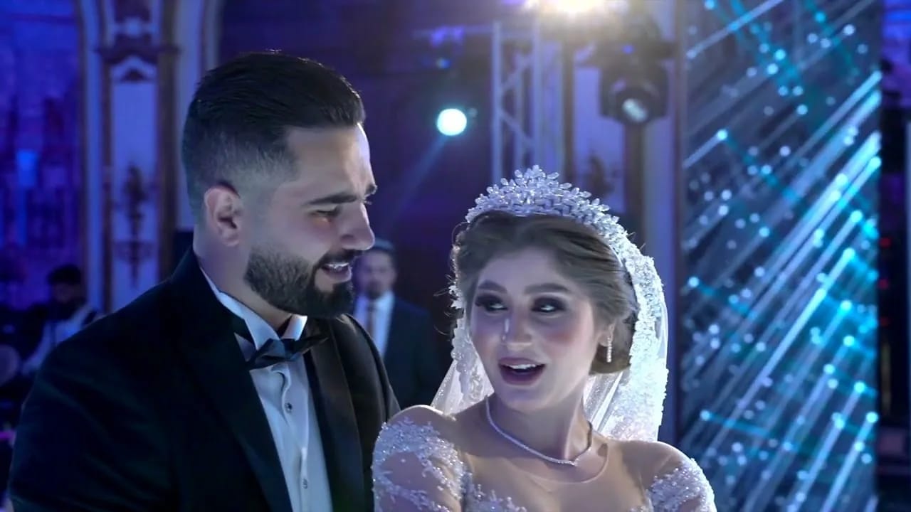 A bride and groom under stage lights at Le Royal Hotel, Amman