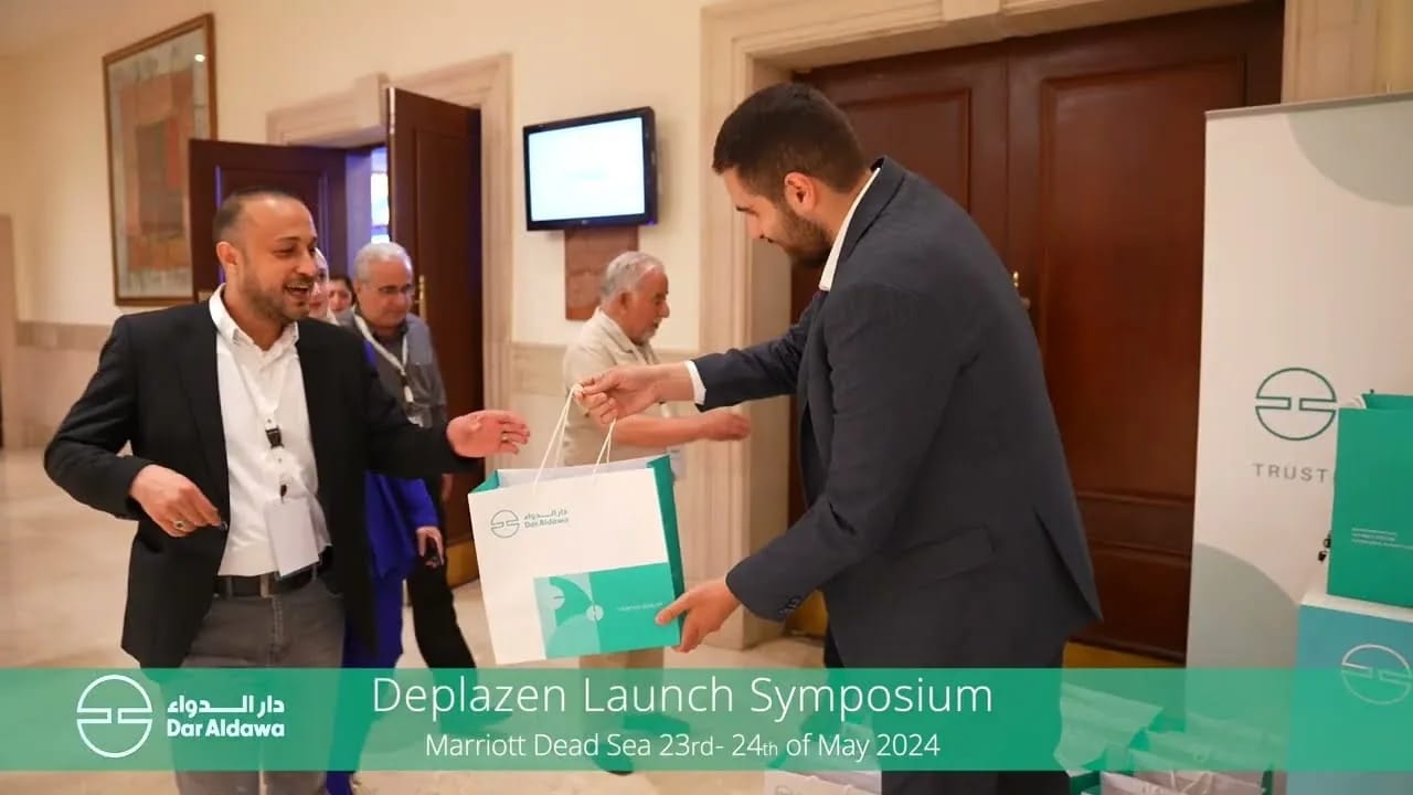 A guest receiving a welcome bag at the Dar Al Dawa symposium, Dead Sea