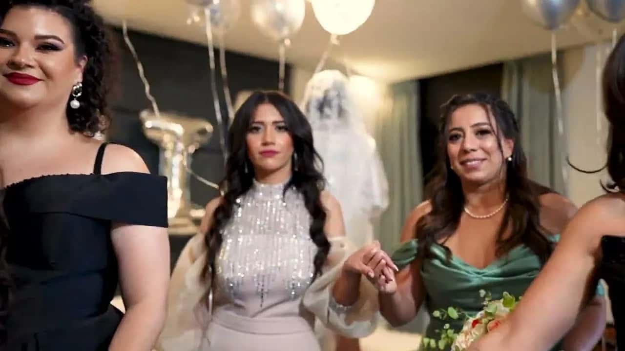 Bridesmaids laughing together before the wedding, balloons behind them